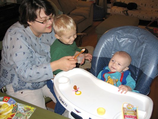 Mommy and Tim giving Cole his first food (11-23-2005 18:40)
