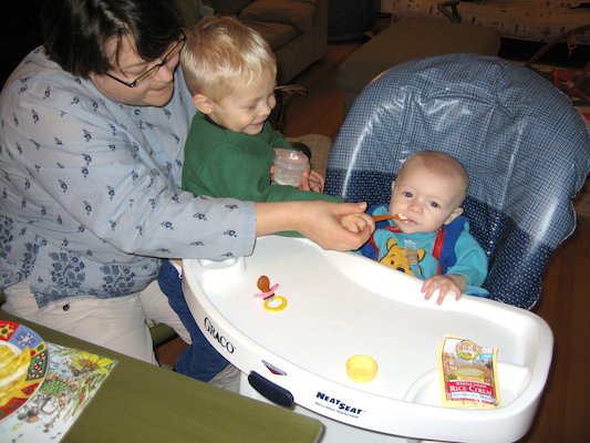 Mommy and Tim giving Cole his first food (11-23-2005 18:41)