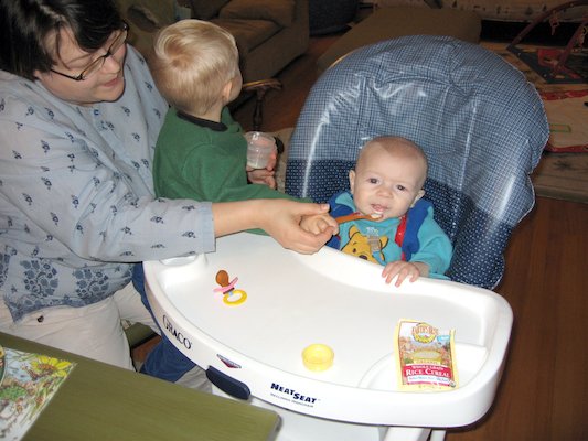 Mommy and Tim giving Cole his first food (11-23-2005 18:41)