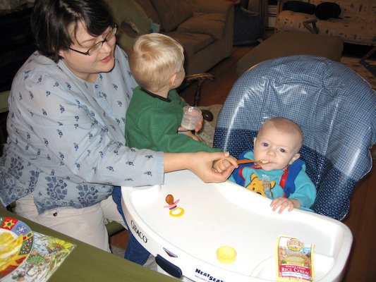 Mommy and Tim giving Cole his first food (11-23-2005 18:41)
