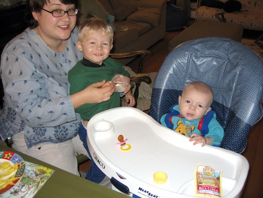 Mommy and Tim giving Cole his first food (11-23-2005 18:41)