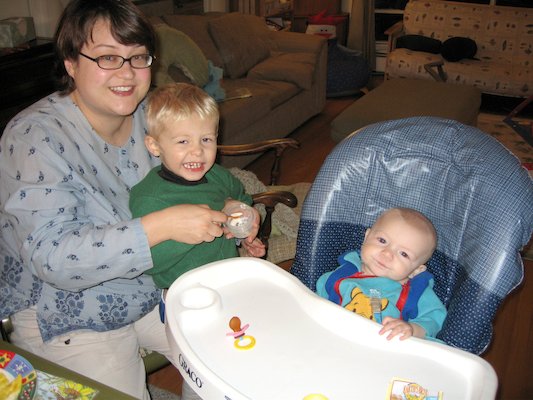 Mommy and Tim giving Cole his first food (11-23-2005 18:41)