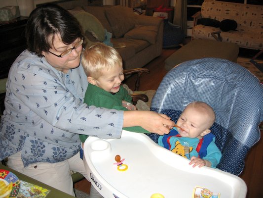 Mommy and Tim giving Cole his first food (11-23-2005 18:41)