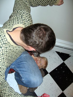 Harrison sitting on Tim-log (12-10-2005 18:35)