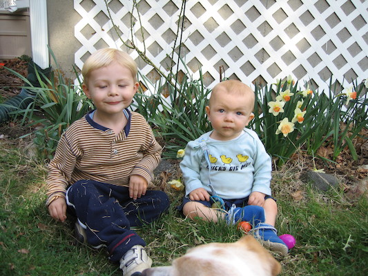 Tim, Cole and Emily by the flowers (04-15-2006 18:34)