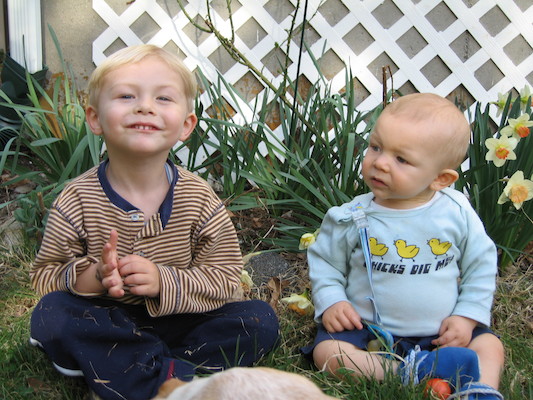 Tim, Cole and Emily by the flowers (04-15-2006 18:34)