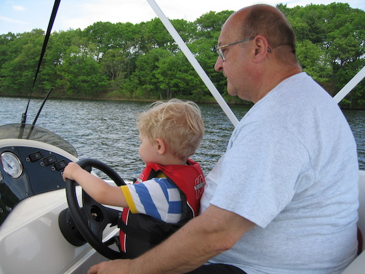 Tim and Poppy driving the boat (05-29-2006 20:38)