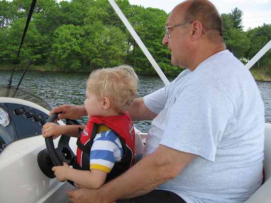 Tim and Poppy driving the boat (05-29-2006 20:38)