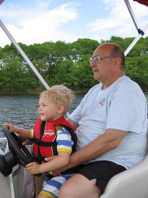 Tim and Poppy driving the boat (05-29-2006 20:38)