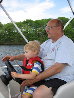 Tim and Poppy driving the boat (05-29-2006 20:38)