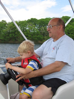 Tim and Poppy driving the boat (05-29-2006 20:38)