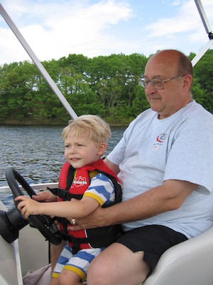 Tim and Poppy driving the boat (05-29-2006 20:38)