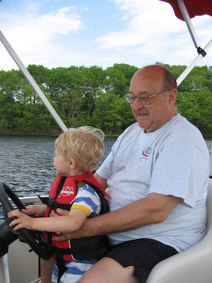 Tim and Poppy driving the boat (05-29-2006 20:37)