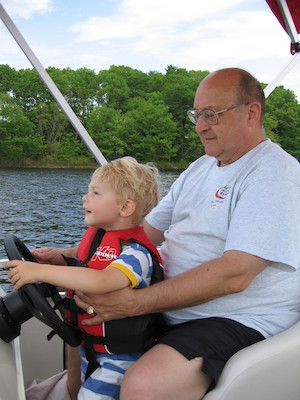 Tim and Poppy driving the boat (05-29-2006 20:38)