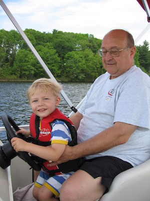 Tim and Poppy driving the boat (05-29-2006 20:38)
