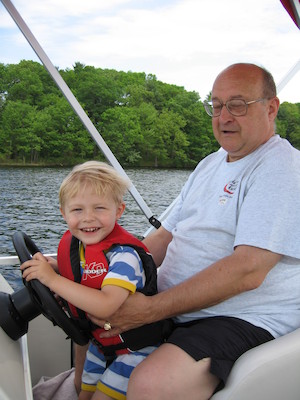 Tim and Poppy driving the boat (05-29-2006 20:37)