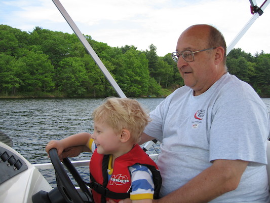 Tim and Poppy driving the boat (05-29-2006 20:38)