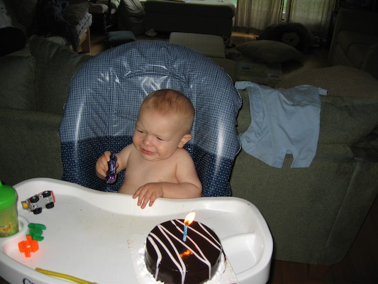 Cole and his birthday cake (06-16-2006)