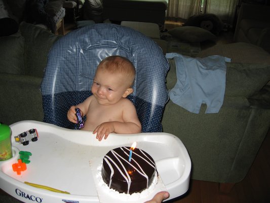 Cole and his birthday cake (06-16-2006)