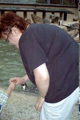 Tim and Xine feeding the penguins