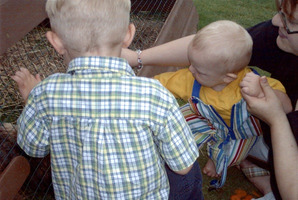 Tim, Cole and Xine looking at bunnies