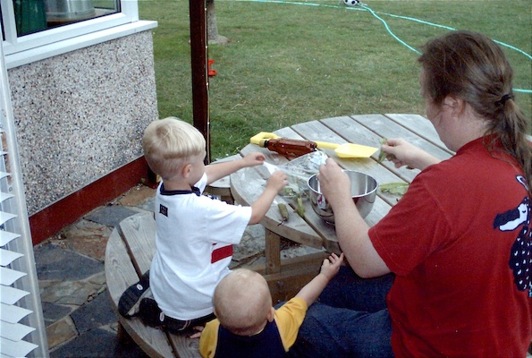 Tim, Cole and Ben shelling beans