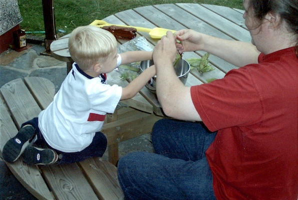 Tim and Ben shelling beans