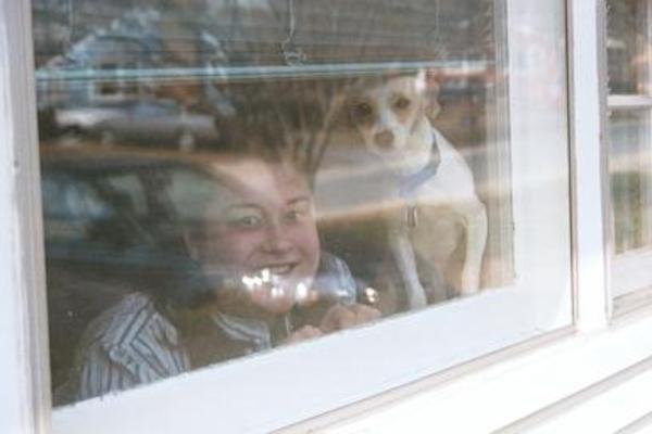 Xine and Emily watching through the window