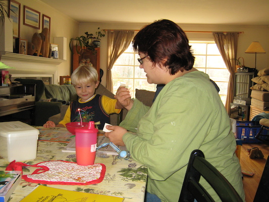 Tim and Xine blowing out the candle (11-09-2006 12:26)