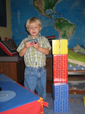 Tim checking a picture next to his robot (11-17-2006 12:41)