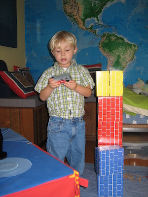 Tim checking a picture next to his robot (11-17-2006 12:41)