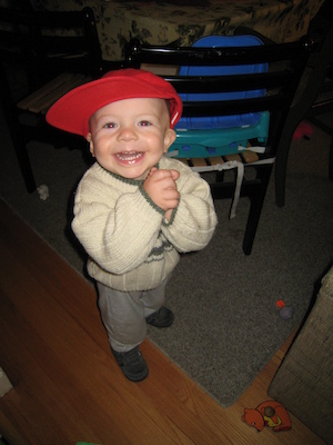 Cole wearing the red hat (cute) (12-05-2006 17:52)