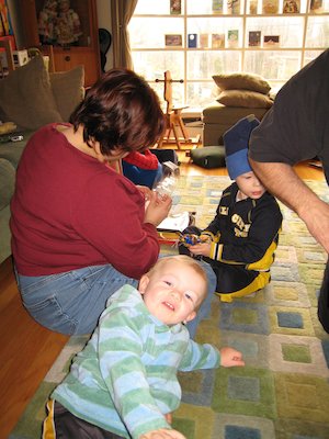 Xine, Cole and Tim opening presents (12-24-2006 10:48)