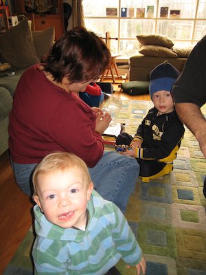 Xine, Cole and Tim opening presents (12-24-2006 10:48)