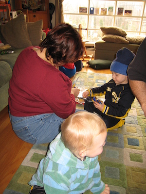 Xine, Cole and Tim opening presents (12-24-2006 10:48)