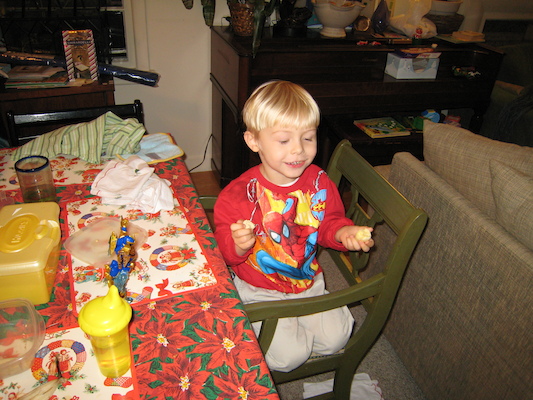 Tim eating in his new Spiderman shirt (12-24-2006 17:23)