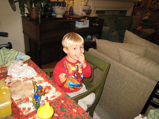 Tim eating in his new Spiderman shirt (12-24-2006 17:23)