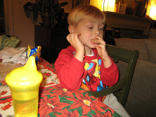 Tim eating in his new Spiderman shirt (12-24-2006 17:26)