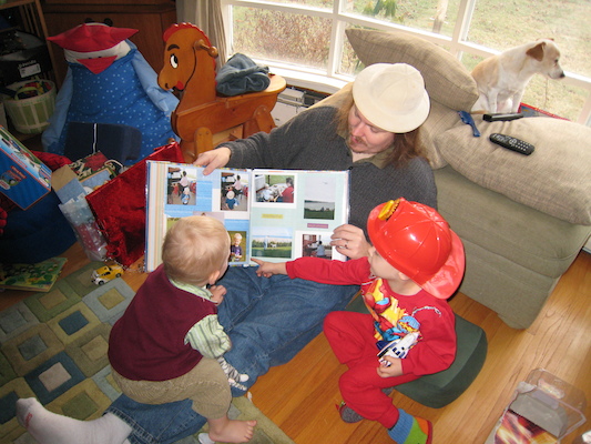 Daddy showing Tim and Cole his present from Mommy (12-25-2006 08:12)