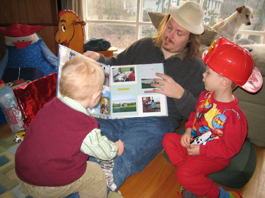 Daddy showing Tim and Cole his present from Mommy (12-25-2006 08:12)