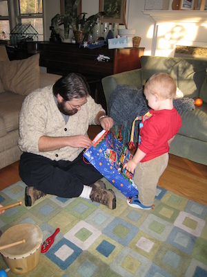 Juj and Cole opening a present (12-31-2006 15:22)