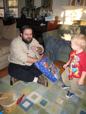 Juj and Cole opening a present (12-31-2006 15:22)
