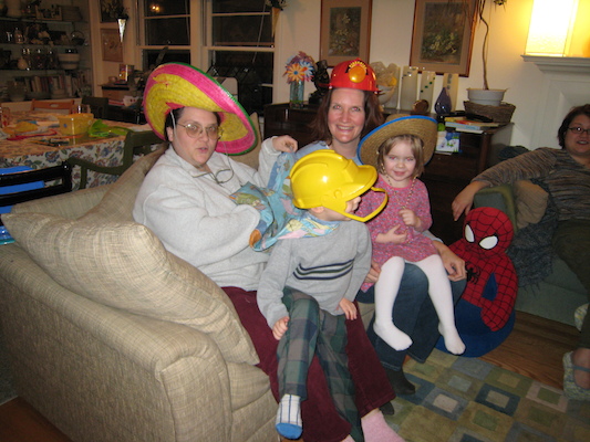 Helene, Barb, Tim and Emma in silly hats (01-28-2007 18:53)