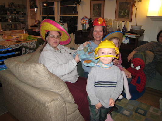 Helene, Barb, Tim and Emma in silly hats (01-28-2007 18:53)