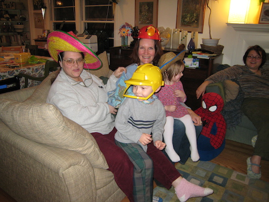 Helene, Barb, Tim and Emma in silly hats (01-28-2007 18:53)