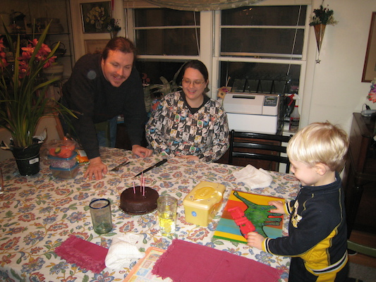 Ben, Helene and Tim blowing out Ben's cake (02-11-2007 18:30)