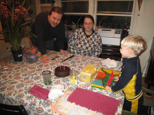 Ben, Helene and Tim blowing out Ben's cake (02-11-2007 18:30)