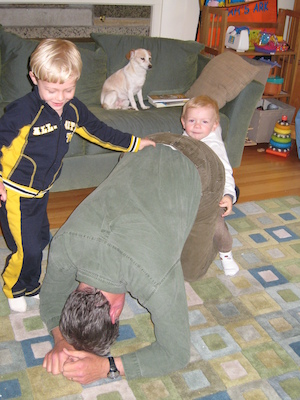 Tim and Cole climb Granddad while Emily watches (05-18-2007 17:09)