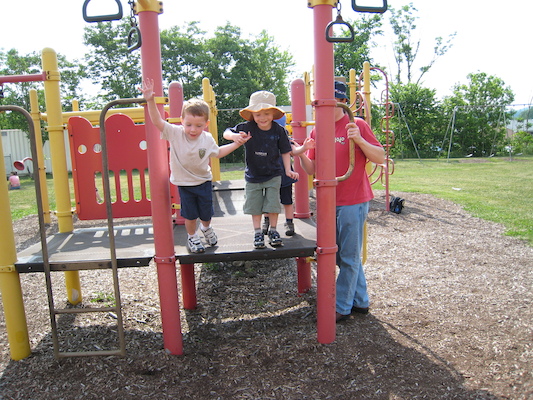 Tate and Tim jumping at the playground (06-13-2007 10:09)