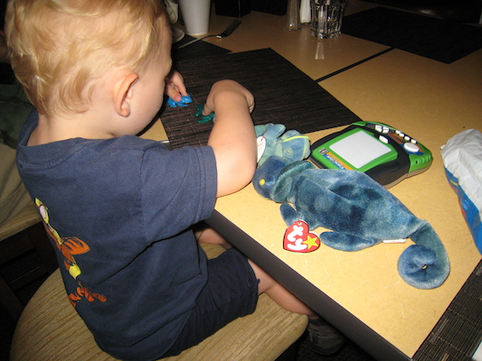 Cole playing with presents (06-13-2007 20:04)
